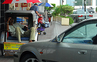 trishaw peddler at rest