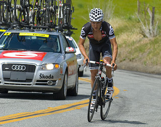 Cervelo rider hustles to catch back up to the peloton after dropping back to the team car 